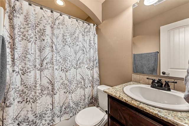 3207 SW Stonepoint Ave, Bentonville, AR 72712 - bathroom with toilet, a shower with shower curtain, and vanity