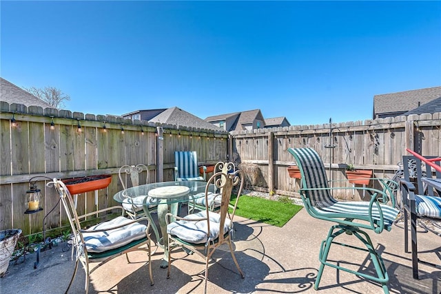 3207 SW Stonepoint Ave, Bentonville, AR 72712 - view of patio with a fenced backyard and outdoor dining space