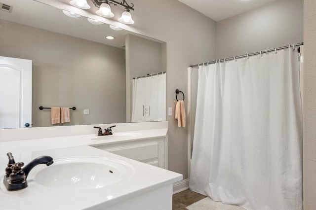 bathroom with double vanity, tile patterned flooring, and a shower with shower curtain