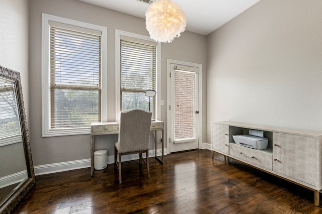 home office with wood finished floors, plenty of natural light, and baseboards