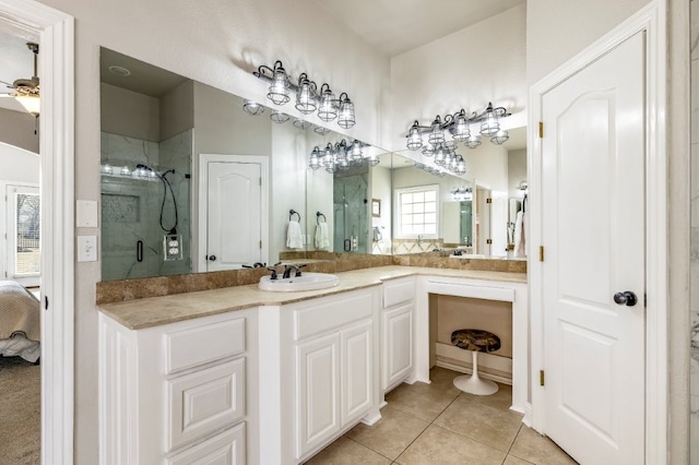 bathroom with a stall shower, tile patterned flooring, connected bathroom, and vanity