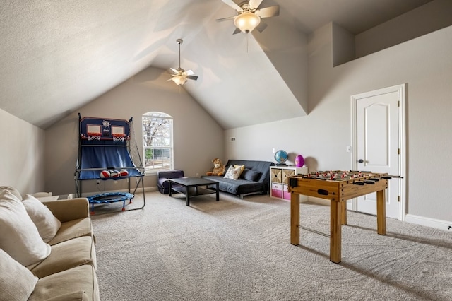game room with a ceiling fan, carpet floors, vaulted ceiling, and baseboards