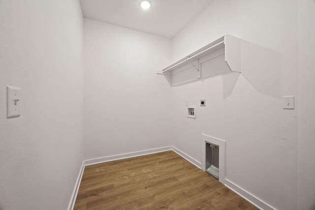 5 Kirkstile Ln, Bella Vista, AR 72715 - washroom with baseboards, laundry area, hookup for an electric dryer, wood finished floors, and hookup for a washing machine