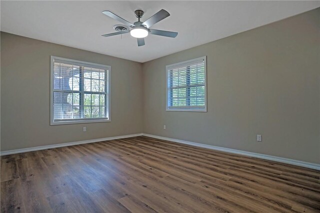 1504 N Hills Blvd, Van Buren, AR 72956 - spare room featuring healthy amount of natural light, wood finished floors, baseboards, and ceiling fan