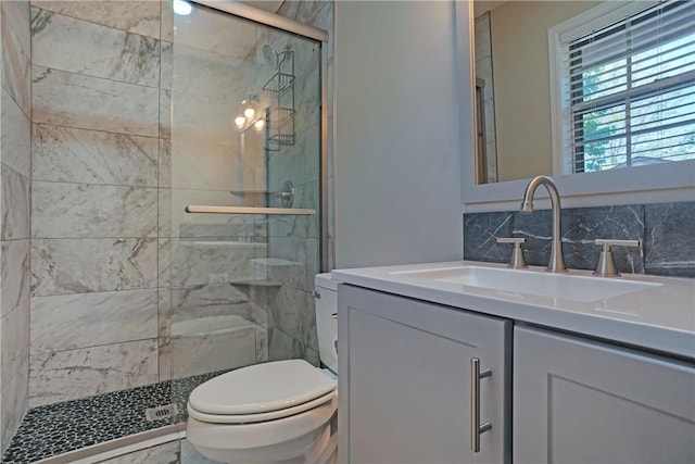 1504 N Hills Blvd, Van Buren, AR 72956 - bathroom featuring toilet, a stall shower, vanity, and tasteful backsplash