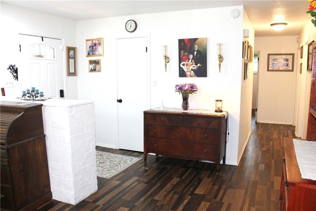 701 Crossbow Rd, Huntsville, AR 72740 - hallway with dark wood-type flooring and baseboards