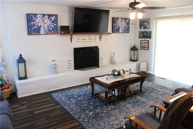 701 Crossbow Rd, Huntsville, AR 72740 - living area featuring ceiling fan, wood finished floors, and a brick fireplace