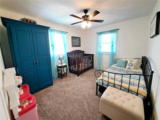 701 Crossbow Rd, Huntsville, AR 72740 - carpeted bedroom featuring a textured ceiling and ceiling fan