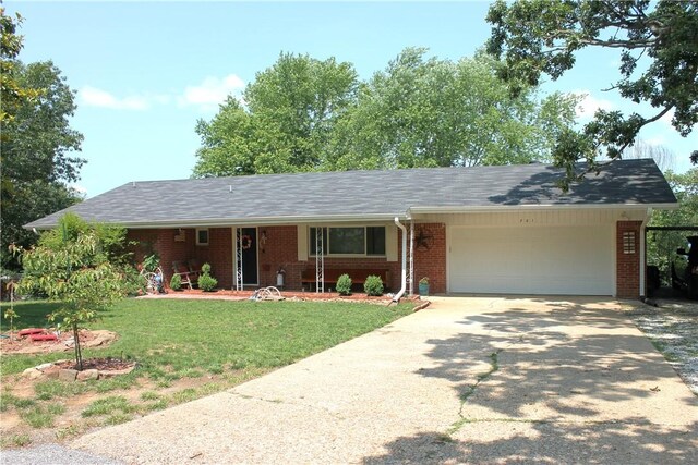 701 Crossbow Rd, Huntsville, AR 72740 - ranch-style house featuring brick siding, a garage, a front lawn, and driveway