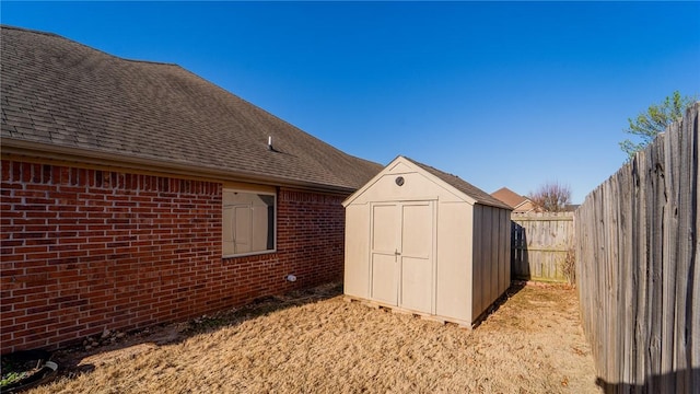 view of shed featuring a fenced backyard