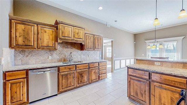 kitchen with stainless steel dishwasher, brown cabinets, a sink, and decorative backsplash