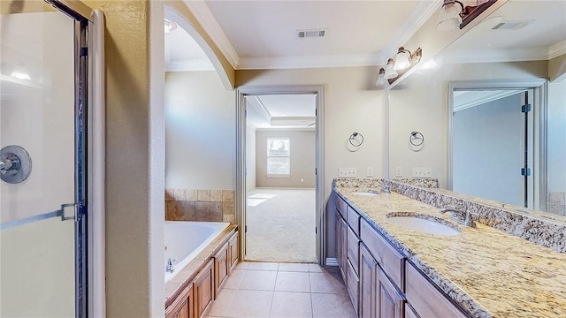 full bathroom featuring a sink, a whirlpool tub, double vanity, and crown molding