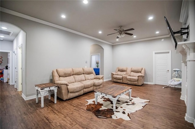 living area featuring visible vents, arched walkways, a ceiling fan, recessed lighting, and wood finished floors