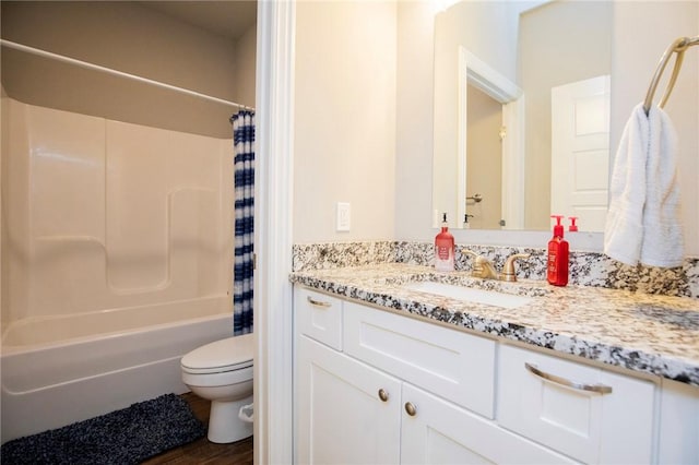 bathroom featuring toilet, vanity, and shower / bath combination with curtain