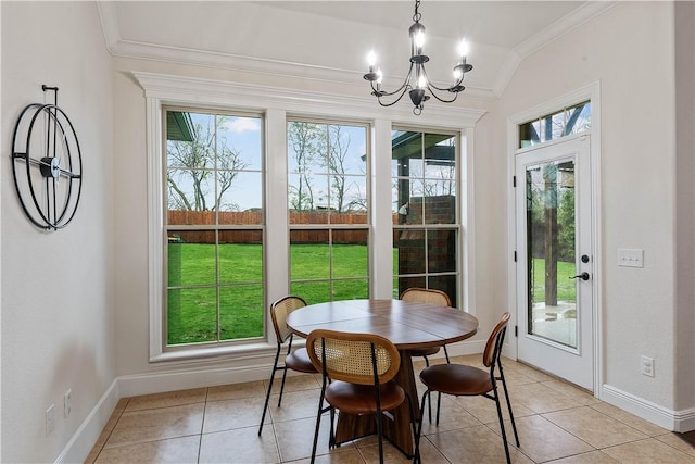 dining room with crown molding, light tile patterned floors, baseboards, and a chandelier