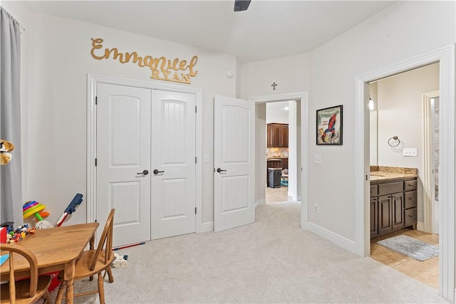 office featuring baseboards and light colored carpet