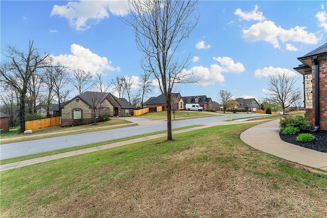 view of yard with fence and a residential view