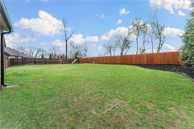 view of yard with a fenced backyard