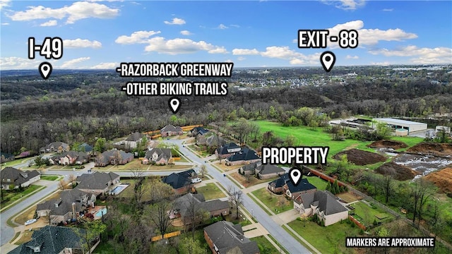birds eye view of property with a residential view