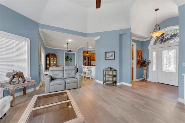 1402 NE Fairwinds Dr, Bentonville, AR 72712 - living area featuring light wood-style floors, high vaulted ceiling, and baseboards