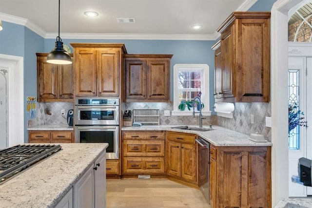 1402 NE Fairwinds Dr, Bentonville, AR 72712 - kitchen featuring visible vents, plenty of natural light, a sink, appliances with stainless steel finishes, and light wood finished floors