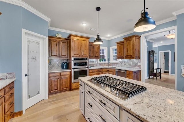 1402 NE Fairwinds Dr, Bentonville, AR 72712 - kitchen with stainless steel appliances, tasteful backsplash, light wood-style flooring, and brown cabinets