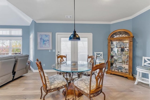 1402 NE Fairwinds Dr, Bentonville, AR 72712 - dining space with ornamental molding, visible vents, baseboards, and light wood finished floors