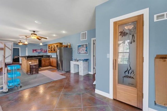 1402 NE Fairwinds Dr, Bentonville, AR 72712 - interior space with visible vents, baseboards, ceiling fan, and dark tile patterned flooring