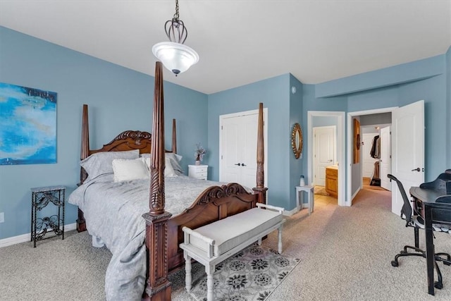1402 NE Fairwinds Dr, Bentonville, AR 72712 - bedroom with baseboards, connected bathroom, and light colored carpet