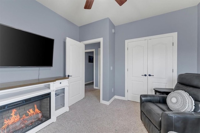1402 NE Fairwinds Dr, Bentonville, AR 72712 - living area with baseboards, a ceiling fan, and light carpet