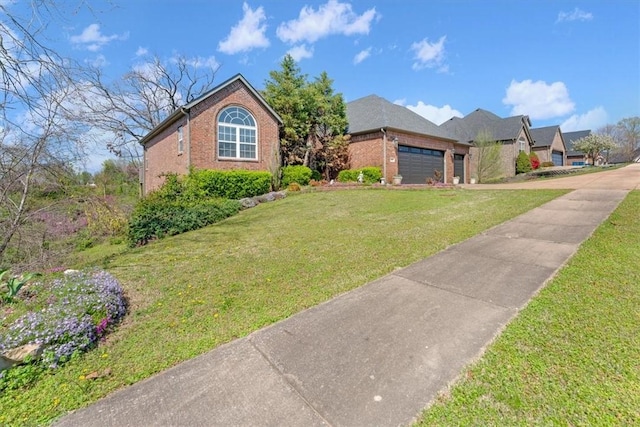 1402 NE Fairwinds Dr, Bentonville, AR 72712 - view of front of house featuring a garage, brick siding, driveway, and a front lawn