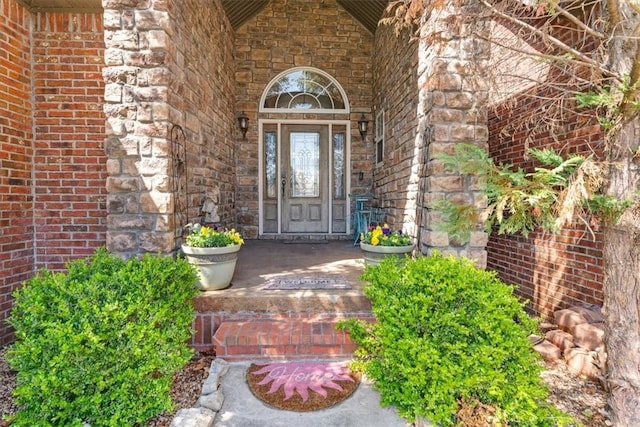 1402 NE Fairwinds Dr, Bentonville, AR 72712 - property entrance with a porch and stone siding