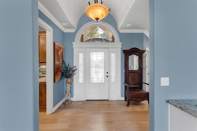 1402 NE Fairwinds Dr, Bentonville, AR 72712 - foyer with visible vents, baseboards, light wood-style floors, crown molding, and vaulted ceiling