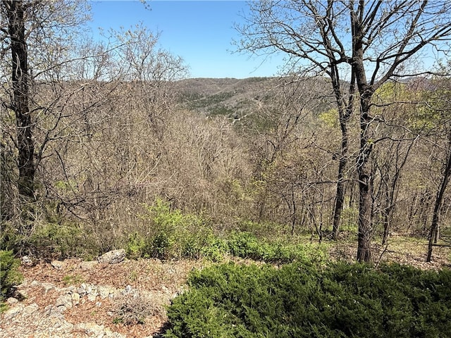 view of landscape with a view of trees