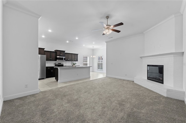 6011 NW Hoover St, Bentonville, AR 72713 - unfurnished living room featuring light carpet, ceiling fan, crown molding, and recessed lighting