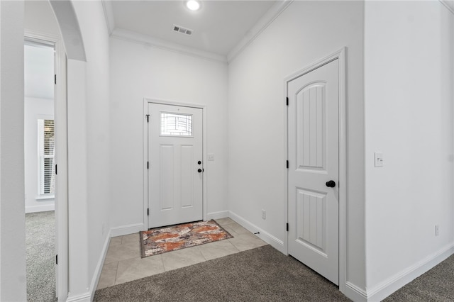 6011 NW Hoover St, Bentonville, AR 72713 - entrance foyer with baseboards, visible vents, light colored carpet, and crown molding