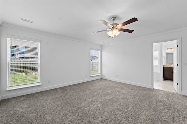6011 NW Hoover St, Bentonville, AR 72713 - unfurnished bedroom featuring baseboards, ornamental molding, light carpet, connected bathroom, and visible vents