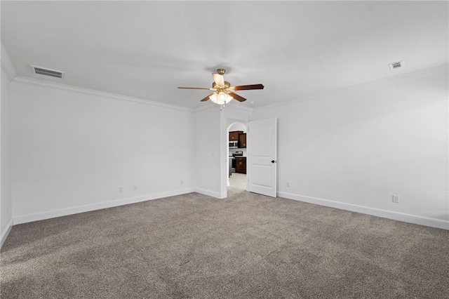 6011 NW Hoover St, Bentonville, AR 72713 - carpeted empty room featuring crown molding, visible vents, a ceiling fan, and arched walkways