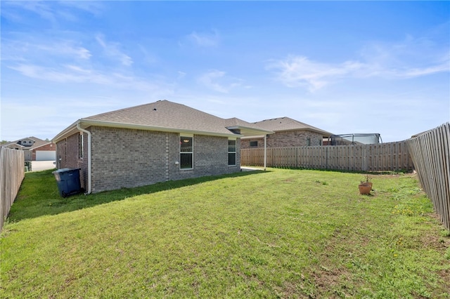 6011 NW Hoover St, Bentonville, AR 72713 - view of yard featuring a fenced backyard