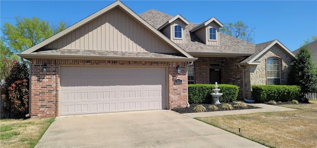 view of front of home featuring roof with shingles, a garage, concrete driveway, and brick siding