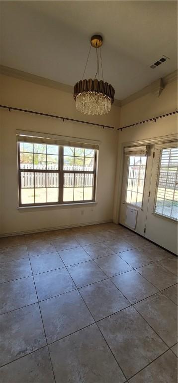 unfurnished dining area featuring tile patterned flooring, visible vents, and baseboards