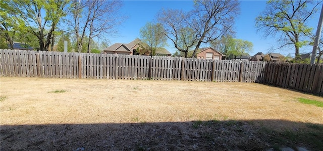 view of yard with a fenced backyard