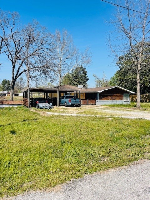 single story home with a carport