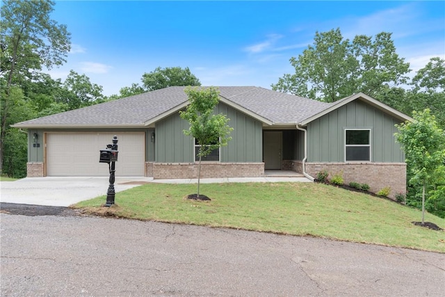 3 Islay Ln, Bella Vista, AR 72715 - ranch-style home with board and batten siding, driveway, an attached garage, a front yard, and brick siding
