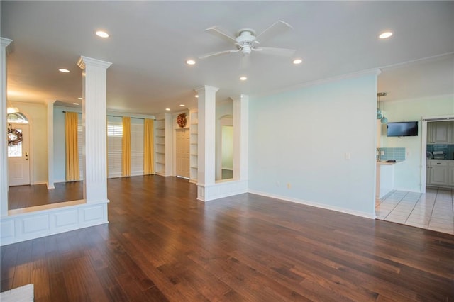 unfurnished living room featuring decorative columns, recessed lighting, and a ceiling fan