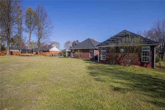 view of yard with a trampoline