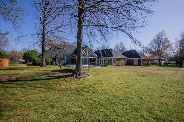 view of yard featuring a trampoline