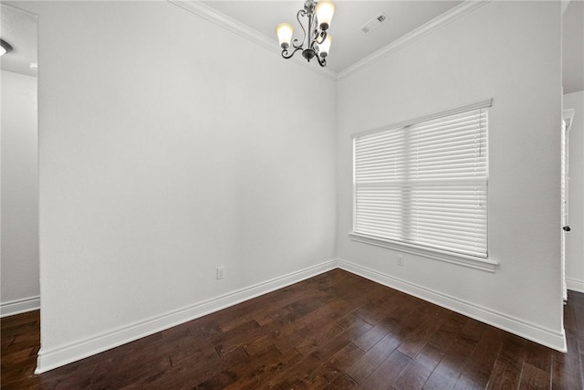 unfurnished room with dark wood-style flooring, a chandelier, baseboards, ornamental molding, and visible vents