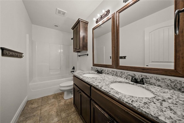 bathroom with visible vents, toilet, baseboards, and a sink