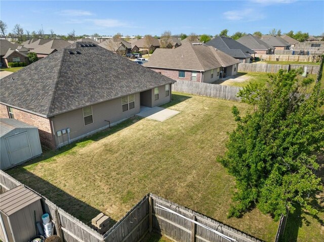 birds eye view of property with a residential view